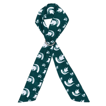Dark green Michigan State scarf featuring a repeating pattern of white Spartan helmet logos and a silver-tone ring detail at the center.
