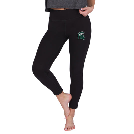 Black women's leggings with a high-rise waistband and green-and-white Michigan State Spartans helmet logo on the upper thigh.