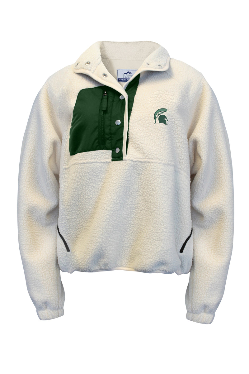 A cream-colored quarter snap fleece with a green right chest pocket and a green Spartan helmet logo on the left chest.
