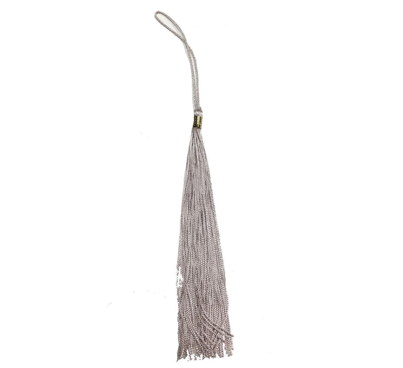 A silver graduation tassel. 