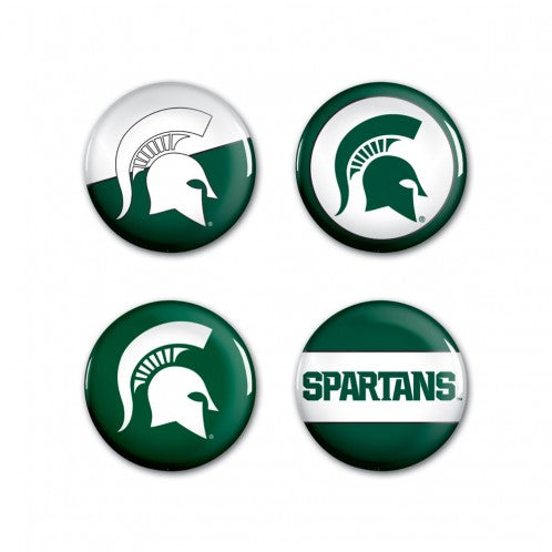 Four circular pin buttons with varying green and white logos and wordmarks representing MSU.