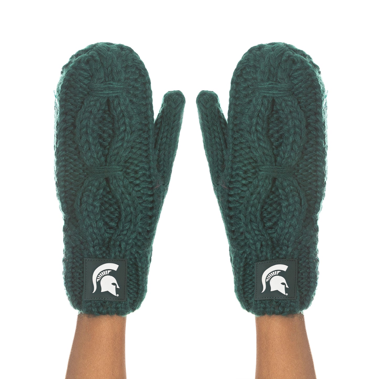 Two arms with dark green cable knit mittens covering the hands. Mittens have a green patch printed with a white Spartan Helmet logo at each wrist.