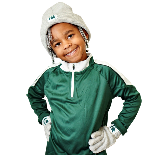 Little girl wearing the youth knit beanie and golve set and smiling with her hands on her hips.