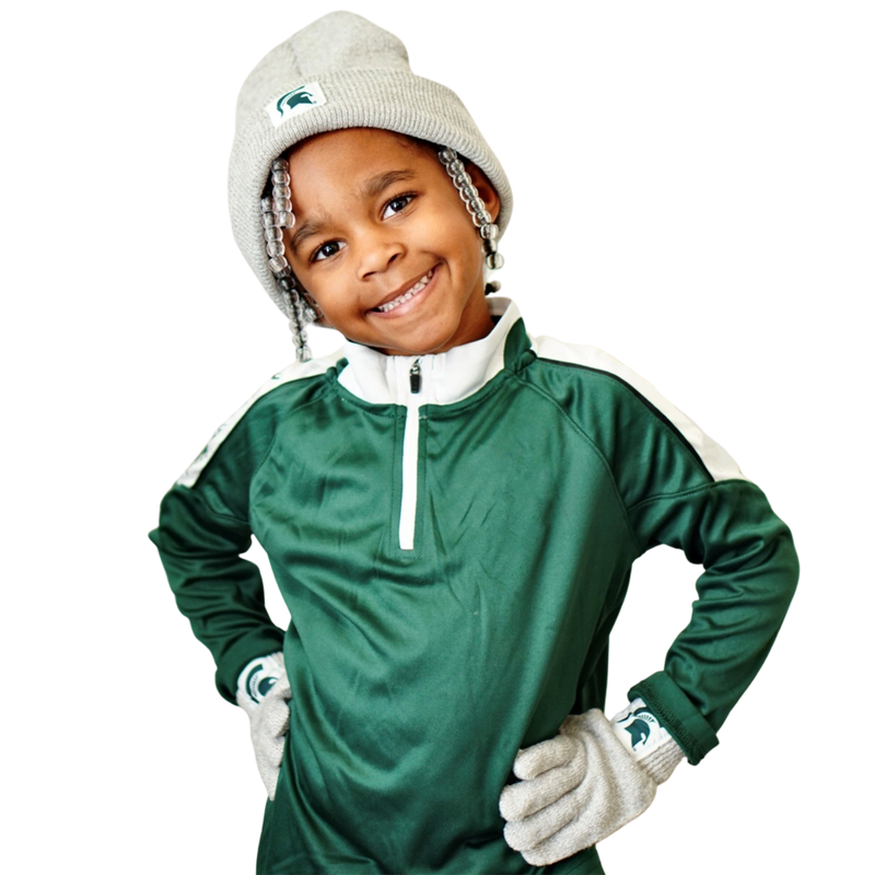 Little girl wearing the youth knit beanie and golve set and smiling with her hands on her hips.