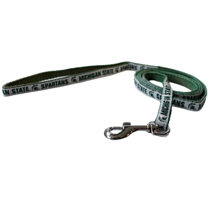 Green woven leash with one side having a solid white ribbon that reads Michigan State and Spartans on either side of a Spartan Helmet logo, all in dark green. At one end is a silver metal spring hook.