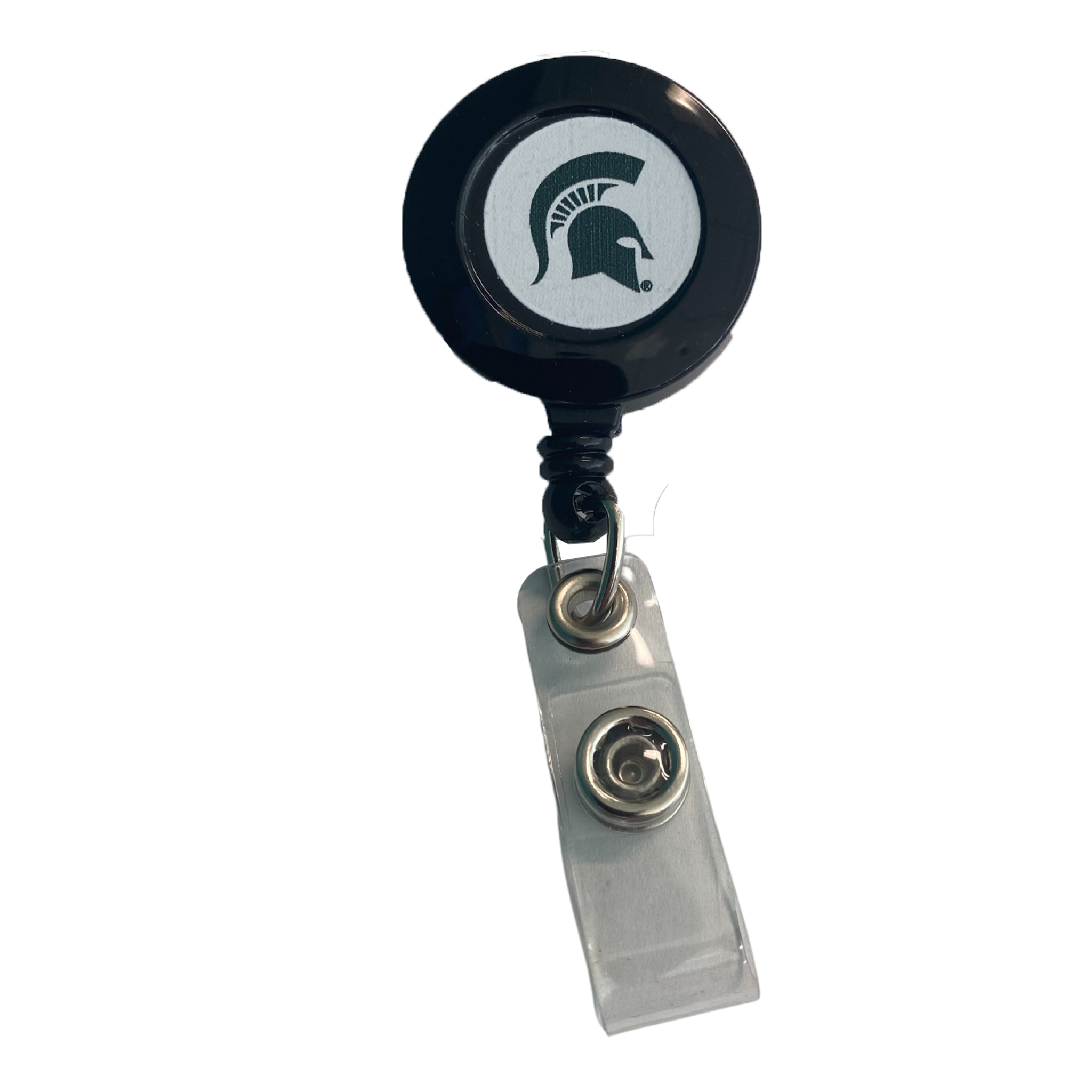 Circular black badge holder with a green Spartan helmet on a white background in its center. It is connected to a white snap strap tab with a metal fastener.