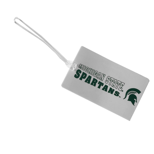 A white, rectangular luggage tag with a clear strap. The words "Michigan State Spartans" in a collegiate font are displayed in a slanted style, with "Michigan State" in white on top and "Spartans" in dark green on the bottom. To the right is a dark green Spartan Helmet logo.
