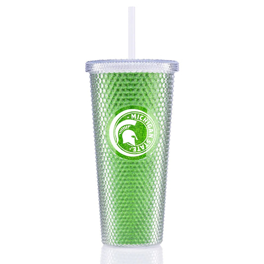 Metallic green tumbler with a studded exterior and a white circular graphic containing a Spartan Helmet logo and text that reads "Michigan State." The tumbler has a plastic lid and straw. 