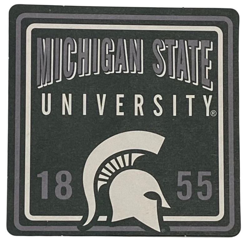 Michigan State University coaster with a white Spartan helmet logo.