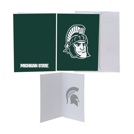 Three views of the Sparty greeting card. The front of the card is dark green with Sparty's face shown large in white, with a white envelope tucked behind it. The back is dark green with the words "Michigan State" in white at the bottom. The inside of the card is white with a faint green Spartan Helmet logo on the right side.