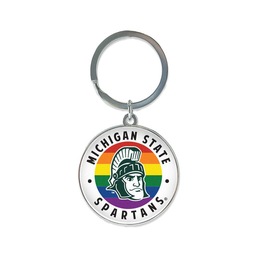 Chrome key chain with a key ring and around chrome circle with a curved "Michigan State" at the top and "Spartans" at the bottom. In the middle is rainbow striped design with a cartoon green and white Sparty mascot head.