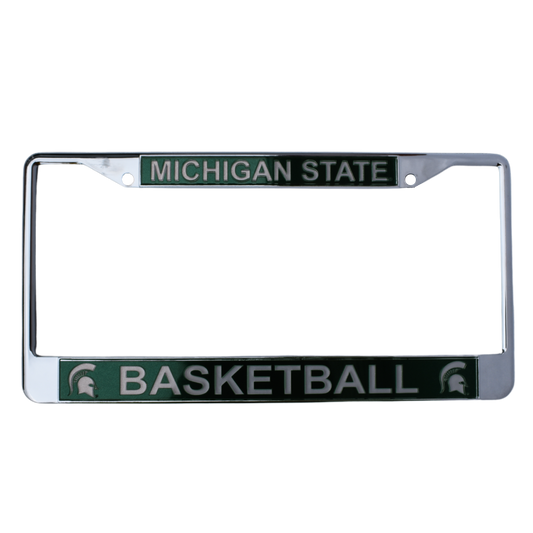 Chrome license plate with two screw holes at the top. A forest green block along the top reads "Michigan State" in all caps and a matching block at the bottom reads "Basketball" in all caps between two Spartan Helmet logos.