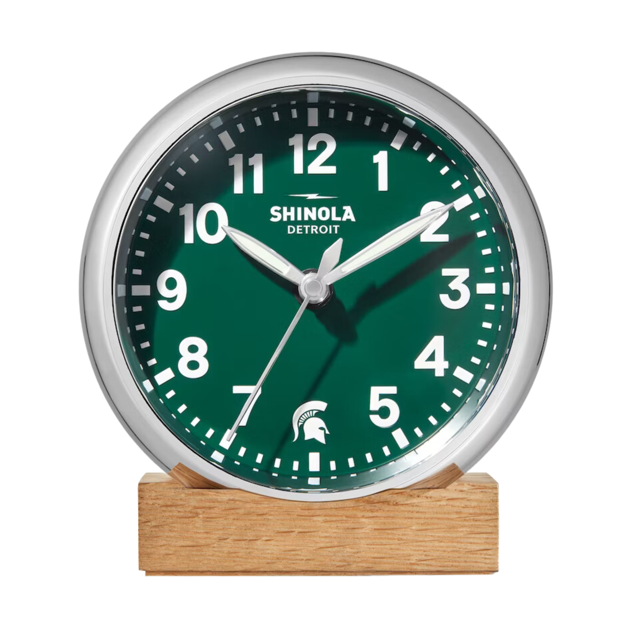 Shinola desk clock with green face and wooden base with white Spartan logo and numbers.