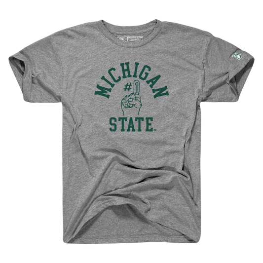 A gray T-shirt with the words Michigan State written in green on the center torso. In the middle of the two words, a graphic of a foam finger with #1 on the index finger is outlined in green.