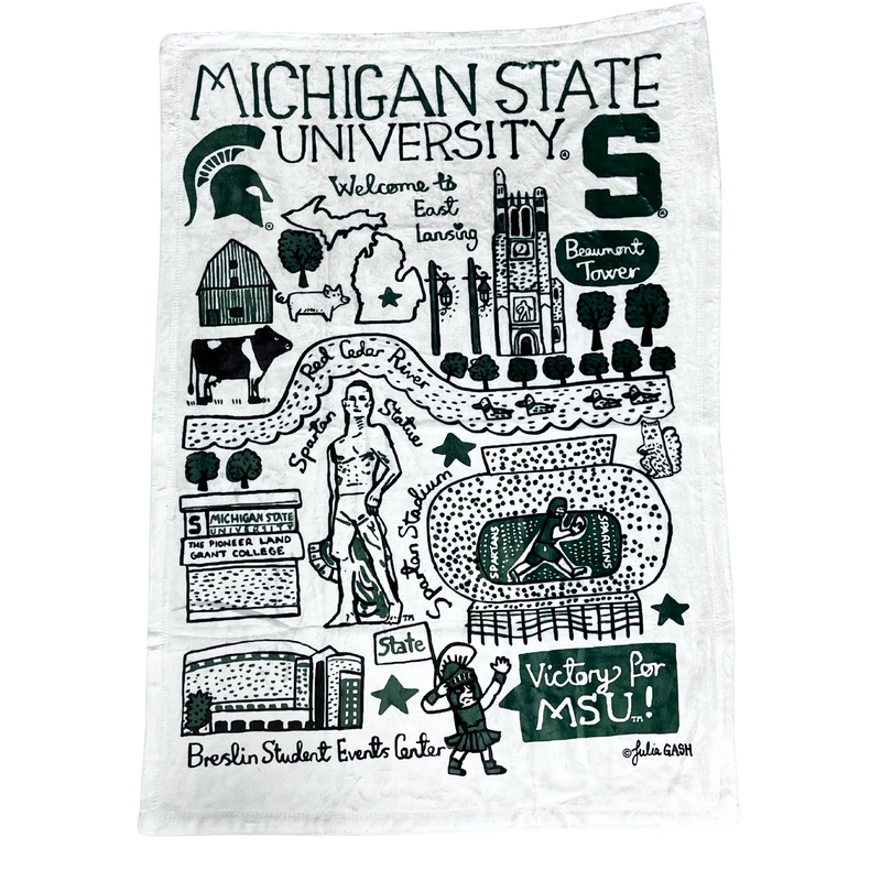 A white, plush fleece blanket measuring 30 inches wide and 40 inches high. On the blanket are multiple drawings of various Michigan State University landmarks.