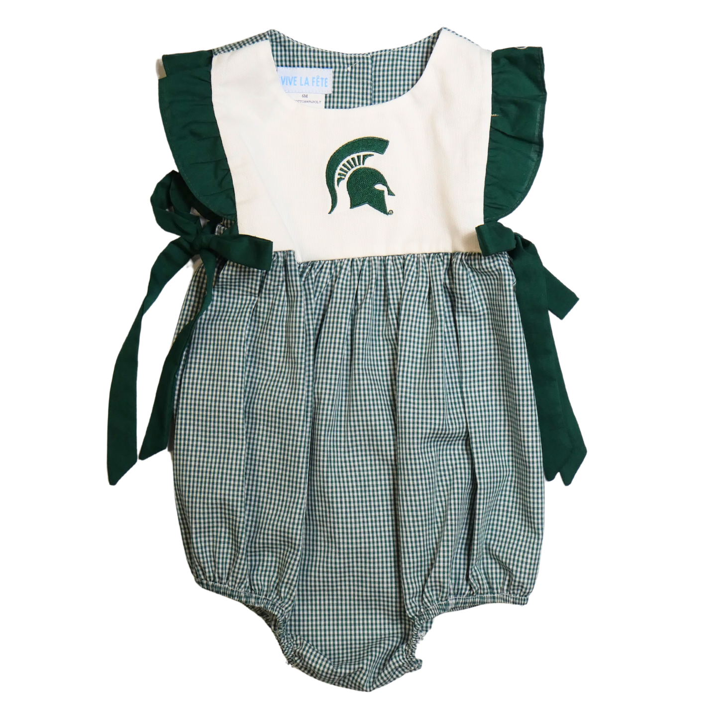 Front of a sleeveless baby jumper. The green and white plaid bottom has a bubble effect in shape. The top is white with dark green ruffle trim ending in bows at the hip. A dark green Spartan Helmet is embroidered on the center chest.