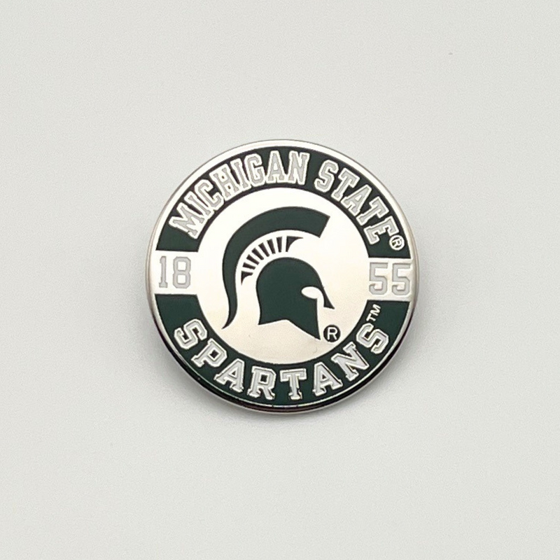 Michigan State Spartans lapel pin with a  green Spartan helmet in the center