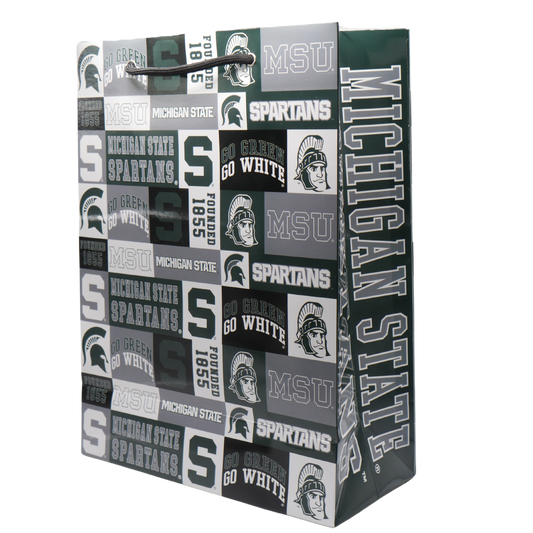 A Michigan State University themed gift bag with various MSU icons, including a block S, Spartan Helmet logo, and Sparty illustration printed in green, gray, white, and black. On the side of the bag "Michigan State Spartans" is written in gray block letters outlined in white. 