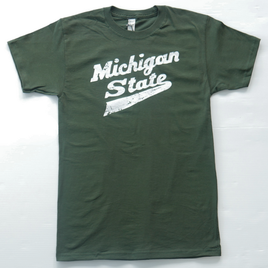 Front of green short sleeve T-shirt with white 'Michigan State' text printed diagonally in cursive font on the center. Shown on a white background. 