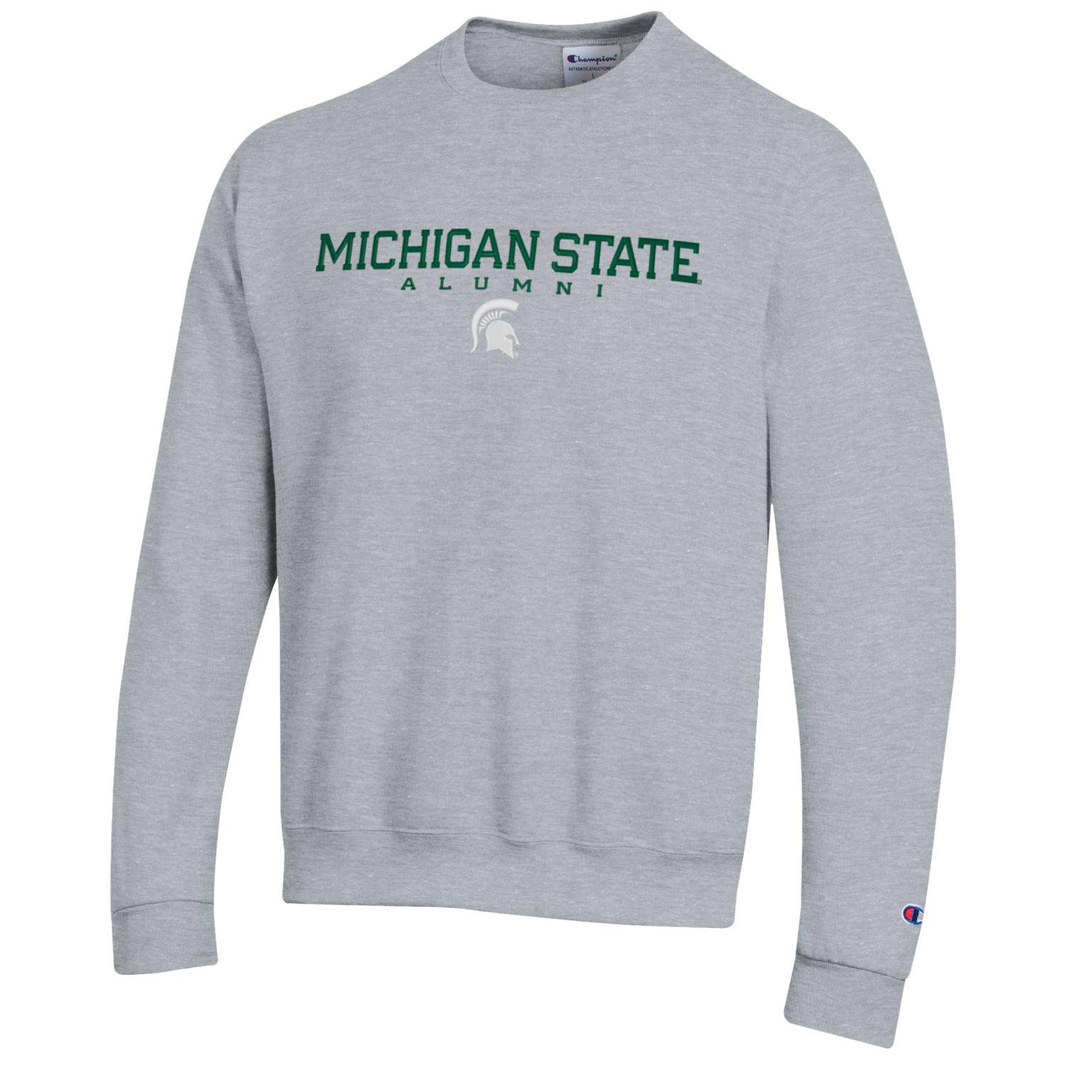 A gray fleece crewneck sweatshirt with green text reading "Michigan State Alumni"