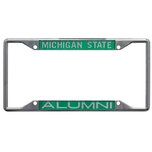 Chrome license plate frame with green inserts featuring 'MICHIGAN STATE' in white text on the top and 'ALUMNI' in white text on the bottom.