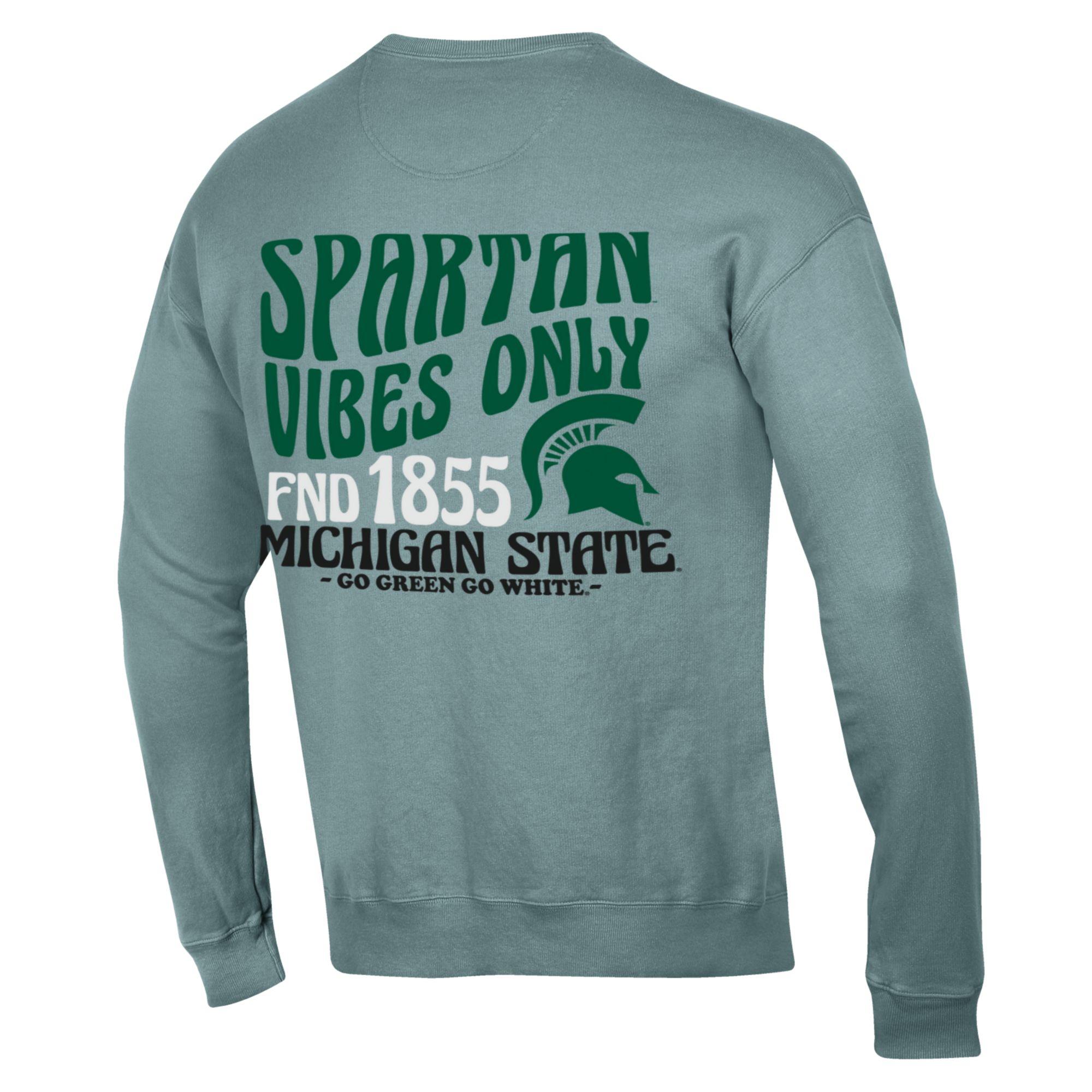 The back of a blue crewneck that reads  "Spartan Vibes Only, Fnd 1855, Michigan State, Go Green Go White" in a groovy font.