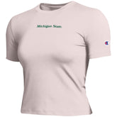 Light pink baby tee with dark green text that reads "Michigan State" and the Champion logo embroidered on left sleeve. 