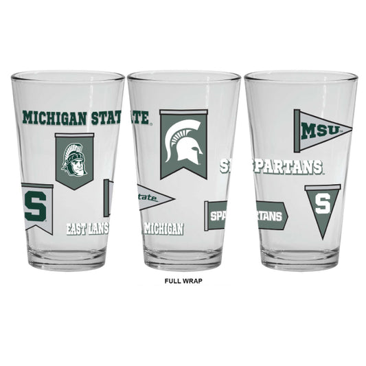 Clear glass Michigan State Spartans pint glass featuring a full-wrap design with multiple team graphics, including the Spartan helmet logo, block "S," Michigan State wordmark, pennant-style banners, "Spartans" text, "MSU," "State," and "East Lansing, MI." Product is shown from three angles to display the complete wraparound design on a light gray background.