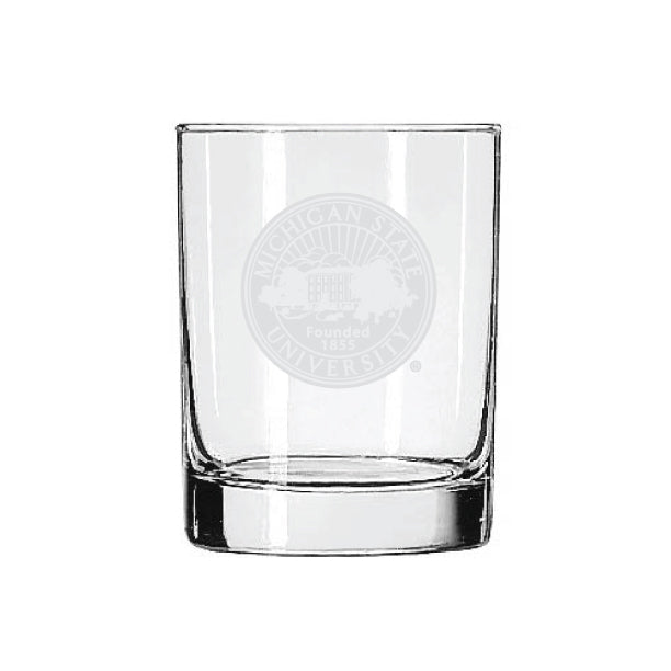 Clear Michigan State University rocks glass featuring a frosted etched university seal with the text “Michigan State University” and “Founded 1855” centered on the front. The heavy-bottom glass has straight sides and a thick base.