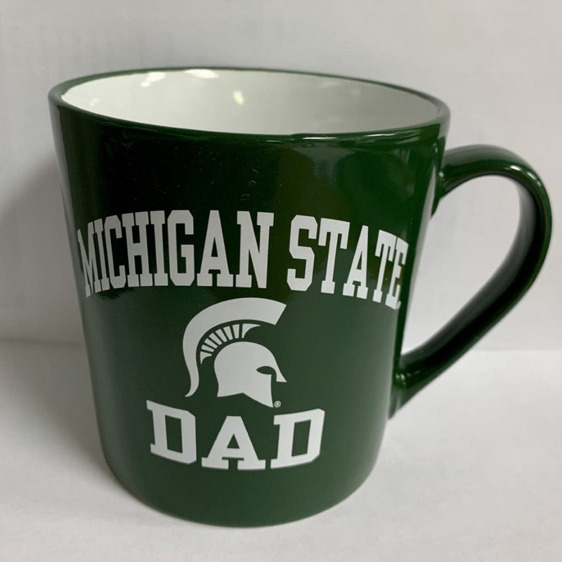 A green and white ceramic mug with 'MICHIGAN STATE DAD' text and a Spartan helmet design.