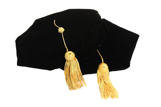 Velvet black doctoral tam with gold tassels.