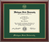 The diploma is mounted on a black matte background with a gold-trimmed frame. With gold Michigan State University seal at top of Matte. At bottom of matte in gold letters is 'Michigan State University'.