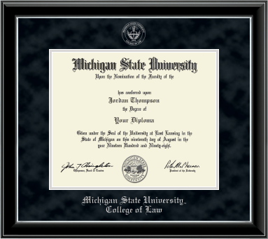 The diploma is enclosed in a dark wood frame with a black suede matte and silver trim, and includes signatures from university officials. Bottom of frame in silver cursive letters is "Michigan State University.". Below in silver and cursive letters is "College of Law."