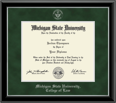 The diploma is enclosed in a dark wood frame with a green suede matte and silver trim, and includes signatures from university officials. Bottom of frame in silver cursive letters is 'Michigan State University'. Below in silver and cursive letters is 'College of Law'. 