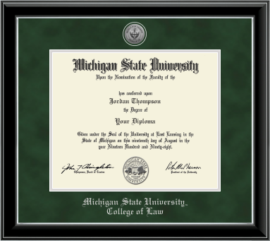 The diploma is enclosed in a black frame with silver accents and set against a green suede matte with silver outline around opening for diploma. Top of matting is silver engraved Law seal. Silver cursive letters is 'Michigan State University' at bottom. Below in silver cursive letters 'College of Law'.