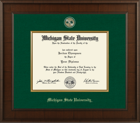 Diploma frame with dark wood frame. Green linen matts with golf engraved Michigan State University Medallion centered above the diploma display opening. Diplomoa frame opening surrounded with gold fillet accents. Michigan State University gold embossed centered below the diploma display opening. 
