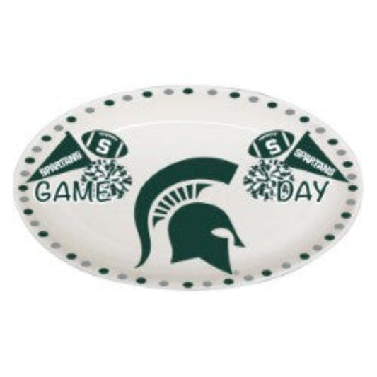 A white oval platter with "Game Day" motifs and a green Spartan helmet in the center.