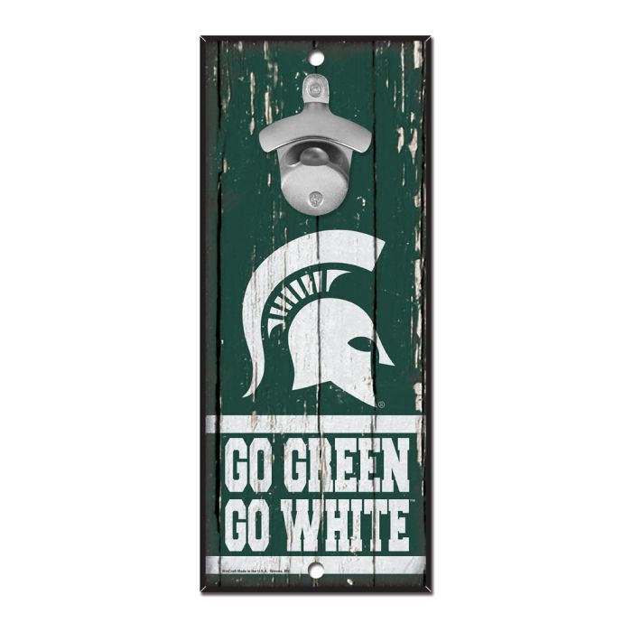 Green wooden board with a metal bottle opener on it as well as a white Spartan helmet and the words 'Go Green Go White' in white lettering.